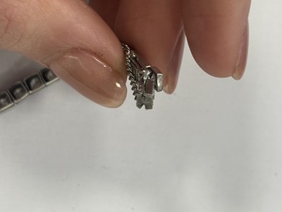 Lot 272 - A LADIES' 18CT WHITE GOLD DIAMOND TENNIS BRACELET
