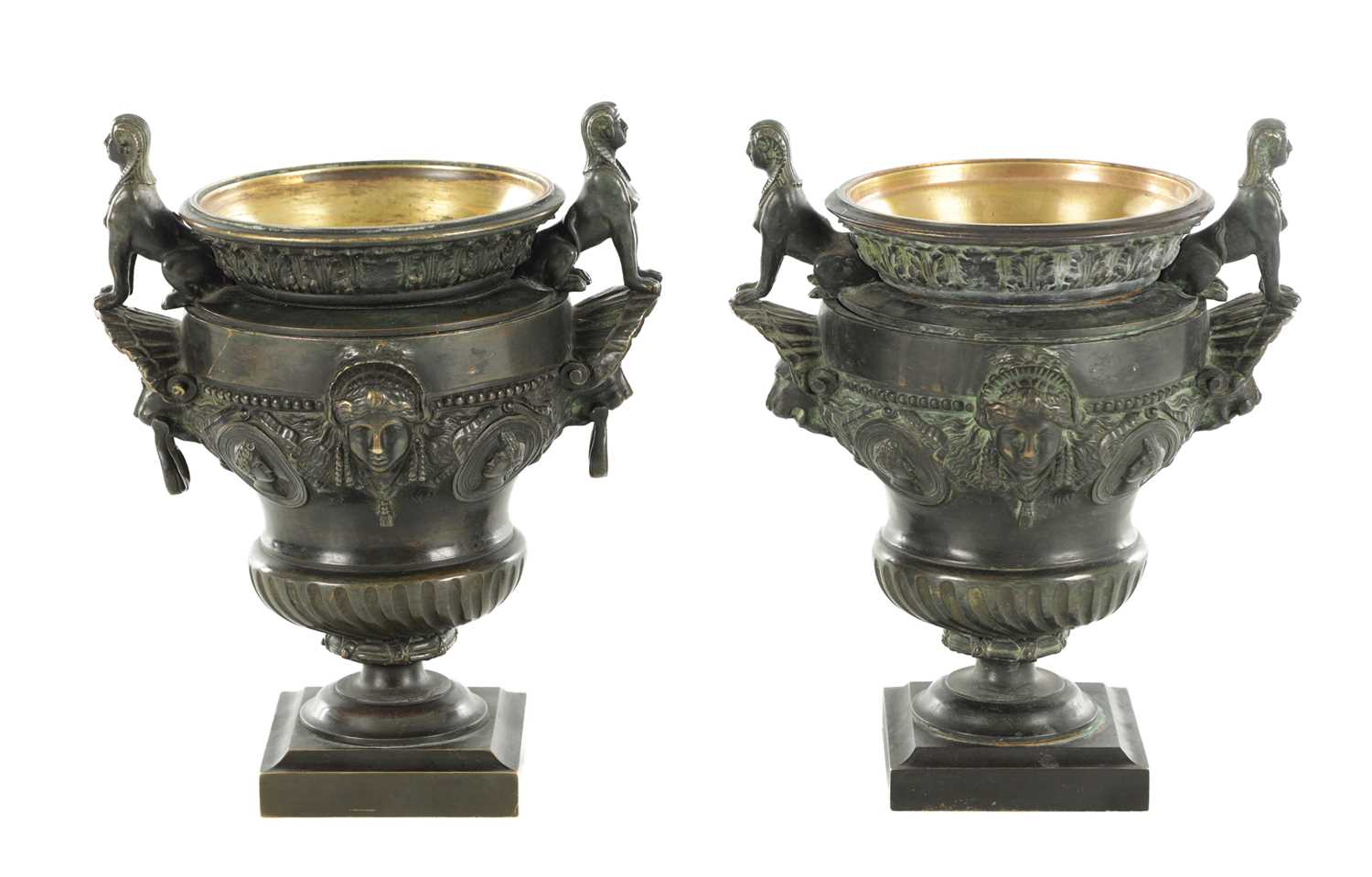 Lot 1062 - A PAIR OF 19TH CENTURY BRONZE REGENCY STYLE URNS