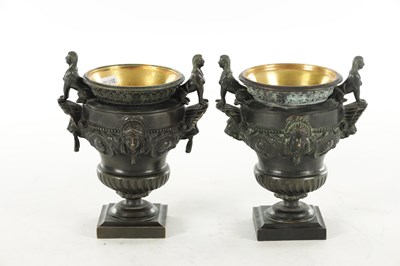 Lot 1062 - A PAIR OF 19TH CENTURY BRONZE REGENCY STYLE URNS
