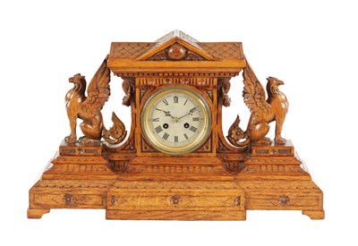 Lot 1357 - A 19TH CENTURY ORNATELY CARVED OAK MANTEL CLOCK