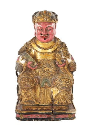 Lot 521 - A 19TH CENTURY CARVED AND POLYCHROME WOOD FIGURE OF A SEATED DEITY