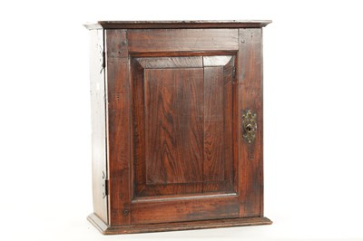 Lot 1662 - A GOOD EARLY 18TH CENTURY ELM HANGING SPICE CABINET