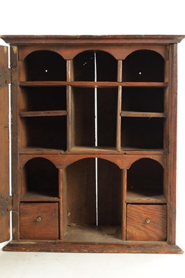 Lot 1662 - A GOOD EARLY 18TH CENTURY ELM HANGING SPICE CABINET