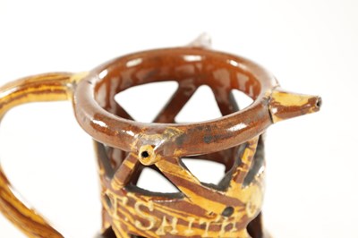 Lot 19 - AN EARLY 20TH CENTURY CLITHEROE SLIPWARE PUZZLE JUG