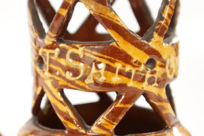 Lot 19 - AN EARLY 20TH CENTURY CLITHEROE SLIPWARE PUZZLE JUG