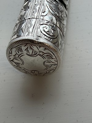 Lot 166 - A VICTORIAN SILVER MOUNTED GREEN GLASS PERFUME BOTTLE AND STOPPER
