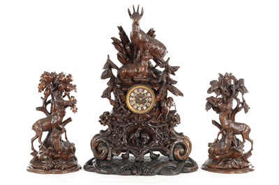 Lot 1293 - A GOOD LARGE 19TH CENTURY BLACK FOREST CARVED LINDEN WOOD THREE-PIECE CLOCK GARNITURE