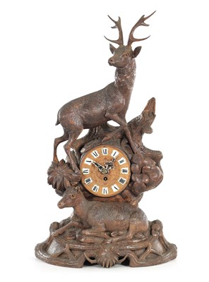 Lot 1436 - A 19TH CENTURY BLACK FOREST CARVED LINDEN WOOD MANTLE CLOCK