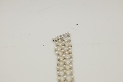 Lot 297 - A 15CT WHITE GOLD PEARL AND DIAMOND CHOKER NECKLACE
