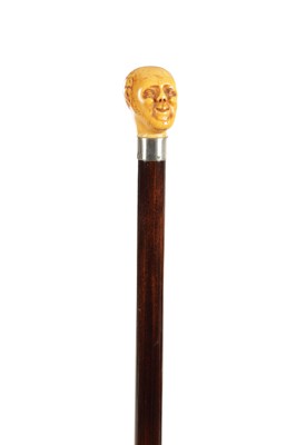Lot 858 - A 19TH CENTURY CARVED IVORY MAN HEAD WALKING CANE