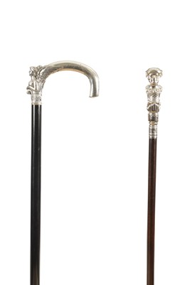 Lot 850 - A RARE 19TH CENTURY SILVER CHILD HANDLED CANE WITH AN EARLY 20TH CENTURY SILVER SPHINX CANE