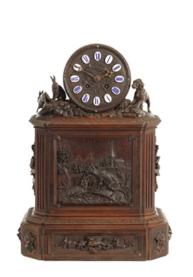 Lot 1404 - A LARGE 19TH CENTURY CARVED BLACK FOREST MANTEL CLOCK