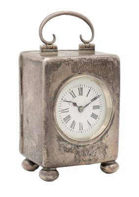 Lot 1374 - AN EARLY 20TH CENTURY SILVER CASED TRAVELLING CARRIAGE CLOCK