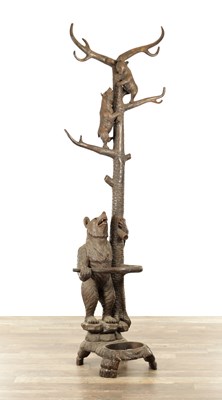 Lot 779 - A LATE 19TH CENTURY BLACK FOREST CARVED BEAR STICK STAND