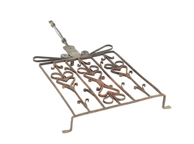 Lot 934 - AN 18TH CENTURY IRONWORK OVERSIZED TRIVET