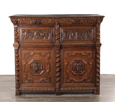 Lot 1542 - A 17TH CENTURY EUROPEAN CARVED OAK CUPBOARD IN TWO PARTS WITH BARLEY TWIST PILASTERS