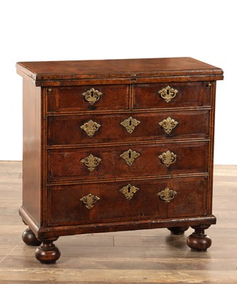 Lot 1495 - A WILLIAM AND MARY HERRING-BANDED AND FIGURED WALNUT BACHELOR'S CHEST OF SMALL SIZE WITH FOLD-OVER TOP