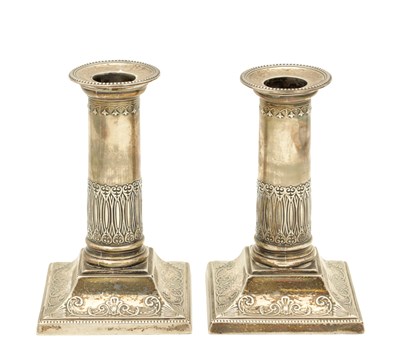 Lot 197 - A PAIR OF EDWARDIAN SILVER CANDLESTICKS