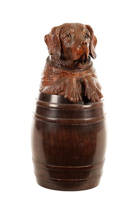 Lot 819 - A 19TH CENTURY CARVED LINDEN WOOD BLACK FOREST TOBACCO JAR FORMED AS A ST. BERNARD DOG SAT IN A BARREL