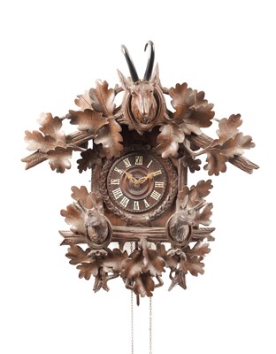 Lot 1284 - A 19TH CENTURY BLACK FOREST CARVED WOOD CUCKOO CLOCK