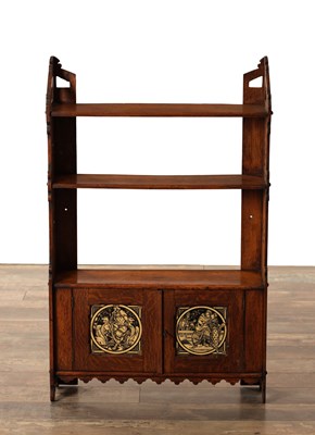 Lot 1490 - A LATE 19TH CENTURY ARTS AND CRAFTS ENGLISH OAK HANGING SHELVES IN THE MANNER OF WILLIAM MORRIS WITH FIGURAL TILED CUPBOARD DOORS
