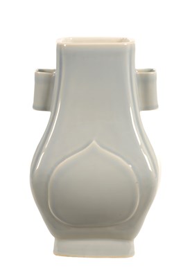 Lot 613 - A CHINESE LAVENDER-BLUE GLAZED PORCELAIN FANGHU VASE