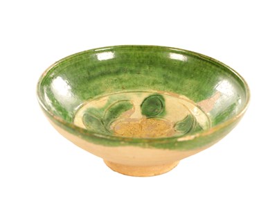 Lot 586 - A CHINESE SANCAI GLAZED POTTERY FOOTED BOWL