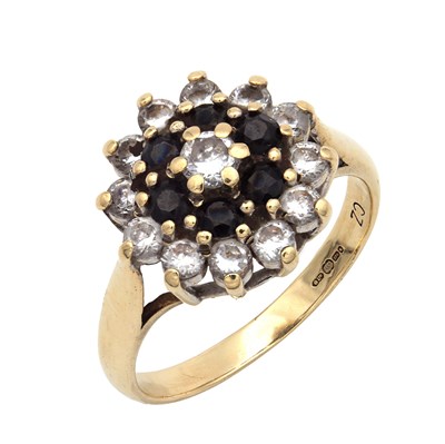 Lot 335 - A 9CT YELLOW GOLD DIAMOND AND ZIRCONIA CLUSTER RING