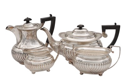 Lot 215 - A LATE VICTORIAN FOUR-PIECE SILVER TEA SERVICE