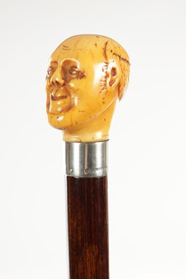 Lot 1450 - A 19TH CENTURY CARVED IVORY MAN HEAD WALKING CANE