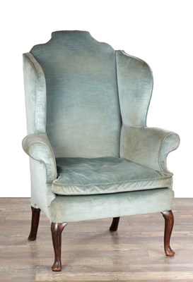 Lot 1667 - A QUEEN ANNE WALNUT UPHOLSTERED WINGBACK ARMCHAIR ON CABRIOLE LEGS