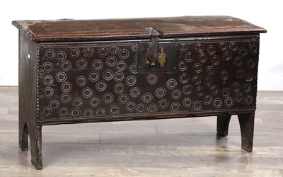 Lot 1643 - A 17TH CENTURY OAK SIX-PLANK COFFER WITH ROUNDEL DECORATION