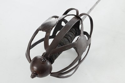 Lot 646 - A 17TH CENTURY BASKET HILTED SWORD