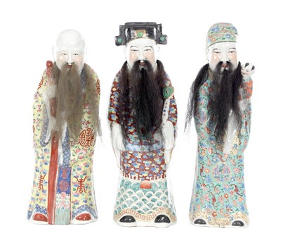 Lot 452 - THREE CHINESE FAMILLE ROSE PORCELAIN FIGURES OF IMMORTALS