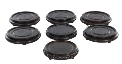 Lot 403 - A COLLECTION OF SEVEN CHINESE TURNED HARDWOOD VASE STANDS