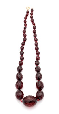 Lot 294 - A GRADUATED CHERRY AMBER BAKELITE FACETED BEAD NECKLACE