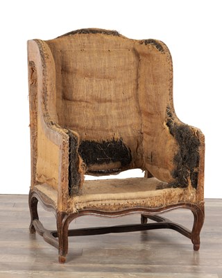 Lot 1368 - AN EIGHTEENTH CENTURY FRENCH WALNUT WINGBACK BERGERE ARMCHAIR