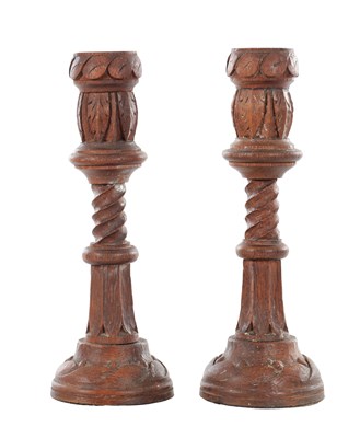 Lot 780 - A PAIR OF 19TH CENTURY GOTHIC REVIVAL CARVED OAK CANDLESTICKS
