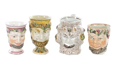 Lot 56 - A COLLECTION OF FOUR 19TH CENTURY STAFFORDSHIRE BACCHUS MUGS