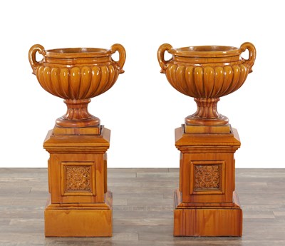Lot 32 - A PAIR OF 19TH CENTURY MAJOLICA GLAZED POTTERY GARDEN URNS ON PEDESTALS