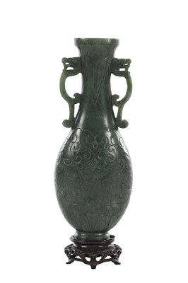 Lot 579 - A CHINESE JADE TWIN HANDLED VASE
