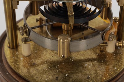 Lot 136 - THE REASON MANUFACTURING COMPANY LTD. AN EARLY 20TH CENTURY MURDAY TYPE ELECTRIC CLOCK WITH GLASS DIAL UNDER GLASS DOME ON TURNED MAHOGANY BASE