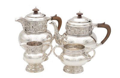 Lot 170 - AN EDWARDIAN ENGLISH SILVER FOUR PIECE TEA SERVICE BY ELKINGTON & CO LTD