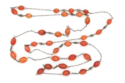 Lot 233 - A CARNELIAN AND SILVER NECKLACE WITH FOUR-LEAF CLOVER SPACERS