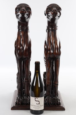 Lot 992 - A FINE PAIR OF 18TH CENTURY CARVED WALNUT HERALDIC GREYHOUND FIGURES