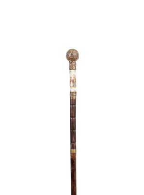Lot 873 - A 19TH CENTURY GOLD PLATED AND PORCELAIN MOUNTED WALKING CANE