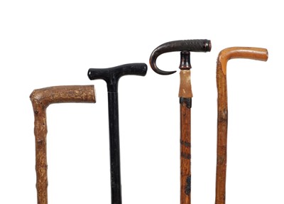 Lot 867 - A COLLECTION OF FOUR WALKING STICKS