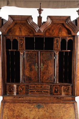 Lot 1539 - A GEORGE I BURR WALNUT BUREAU BOOKCASE WITH BROKEN ARCH PEDIMENT AND MIRRORED DOORS