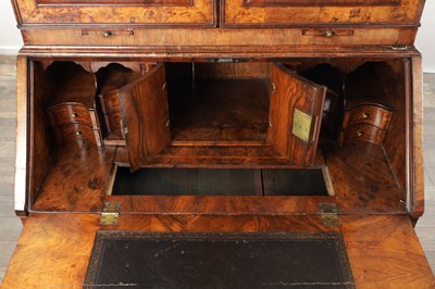 Lot 1539 - A GEORGE I BURR WALNUT BUREAU BOOKCASE WITH BROKEN ARCH PEDIMENT AND MIRRORED DOORS