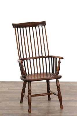 Lot 1376 - A EARLY 19TH CENTURY ELM COMB BACK WINDSOR ARMCHAIR
